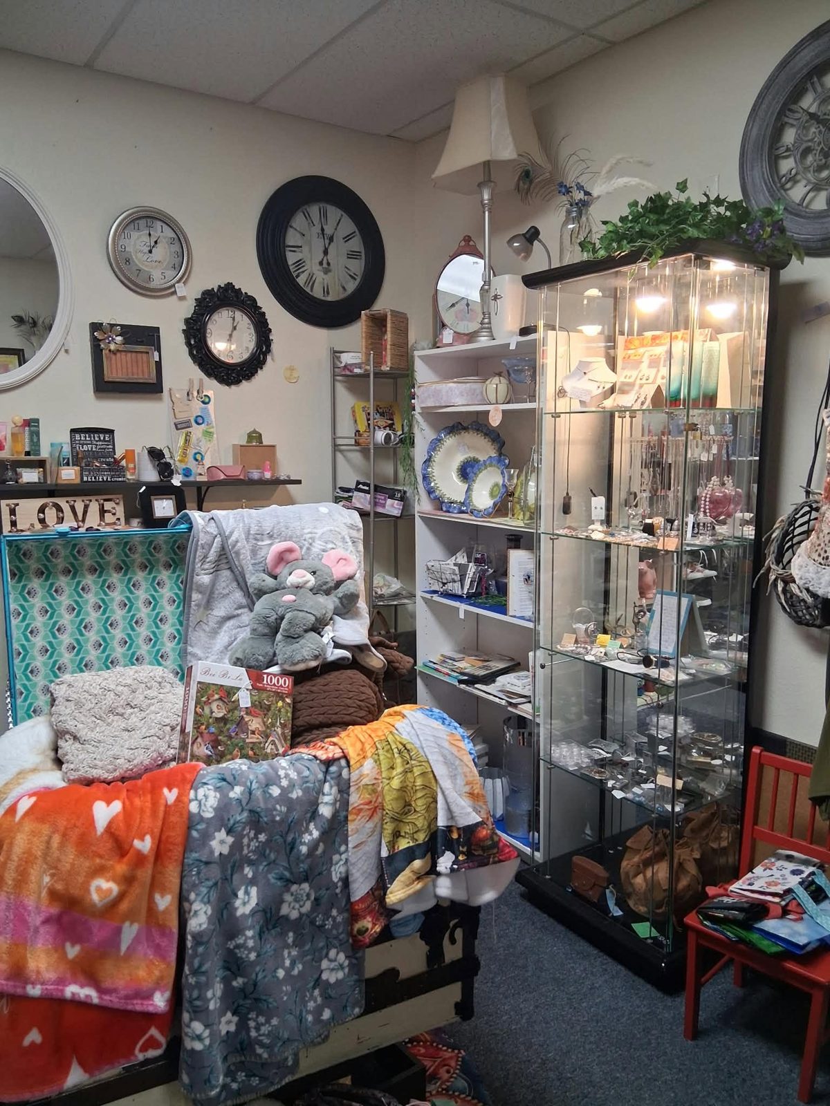 Clocks, lamps and cozy blankets in a vendor booth